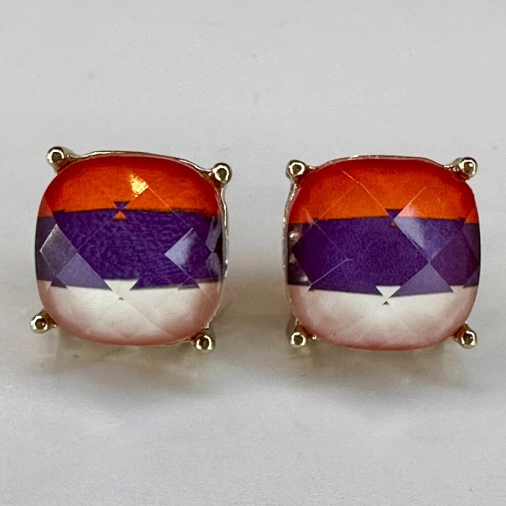 orange, white, and purple pair of stud earrings